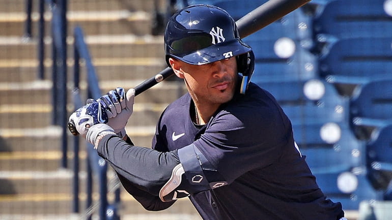 Yankees outfielder Giancarlo Stanton takes batting practice during spring training at George...