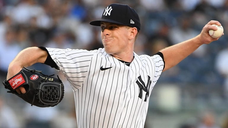 Yankees starting pitcher JP Sears delivers against the Athletics during...
