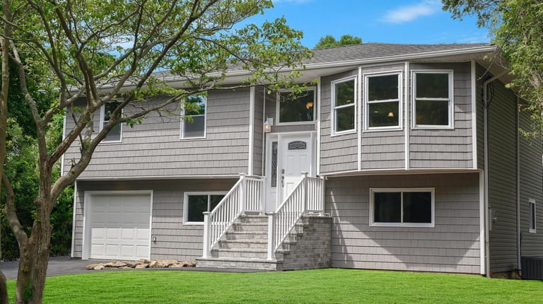 This Mastic high-ranch is listed for $374,888. 