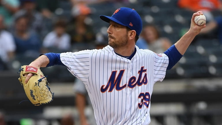 Mets relief pitcher Jerry Blevins delivers against the Miami Marlins...