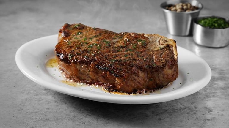 The bone-in New York strip steak at Ruth's Chris Steak House...