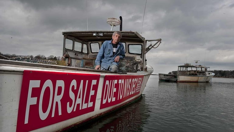 Commercial lobsterman Bob Zickmund on his boat, the Betty Ann...