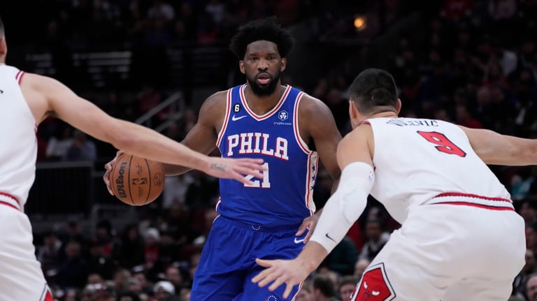 Philadelphia 76ers' Joel Embiid brings the ball up during the...