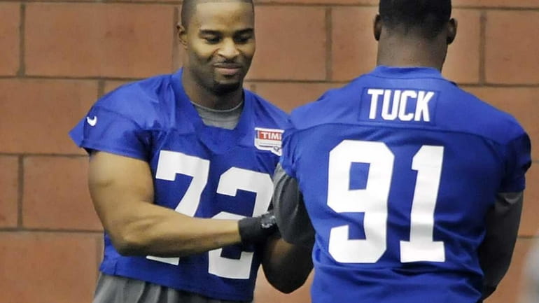 Osi Umenyiora, left, and Justin Tuck during a Giants OTA...