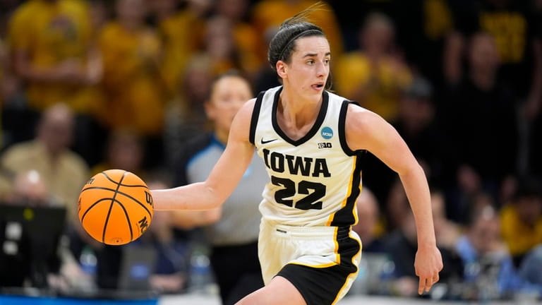 Iowa guard Caitlin Clark drives up court in the second...