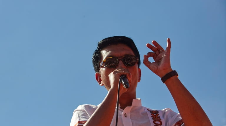 President, Andry Rajoelina, addresses supporters at an election rally in...