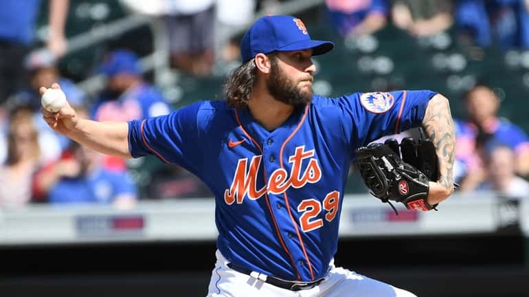 Mets starting pitcher Trevor Williams delivers against the St. Louis...