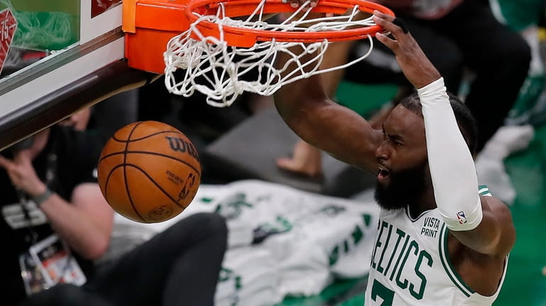 Boston Celtics guard Jaylen Brown (7) dunks the ball against...