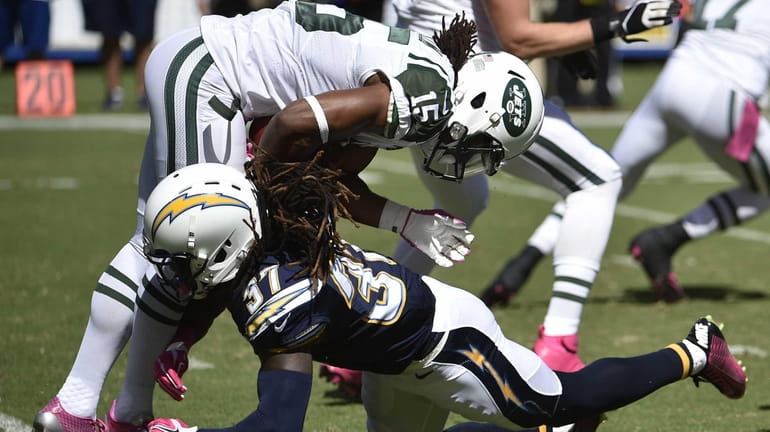 San Diego Chargers defensive back Jahleel Addae, right, tackles Jets...