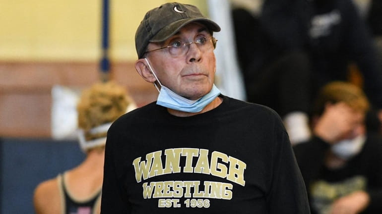 Wantagh wrestling head coach Paul Gillespie takes a look at the scoreboard...
