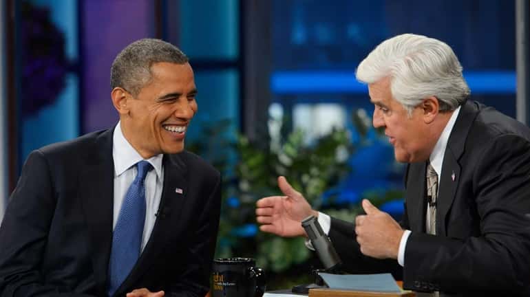 President Barack Obama chats with host Jay Leno during a...