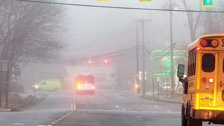 Fog hugs Route 112 as traffic makes its way in...