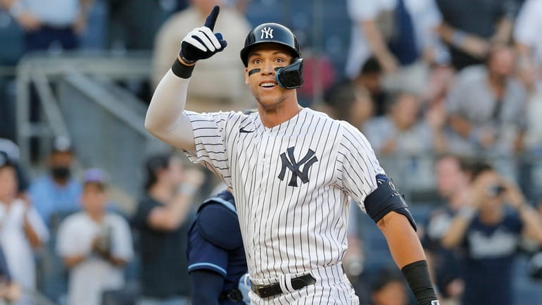 Aaron Judge #99 of the Yankees celebrates his first inning home...