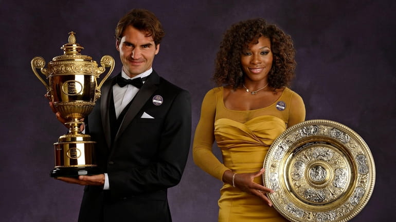 Roger Federer and Serena Williams with their Wimbledon singles trophies...