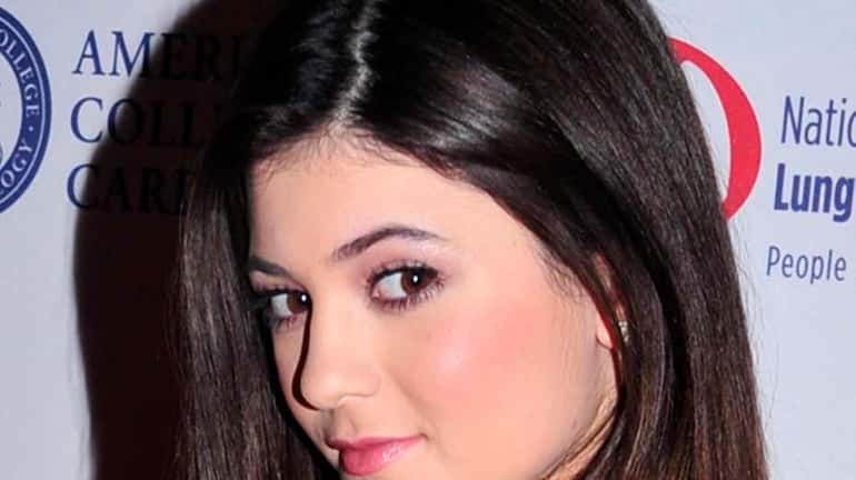 Kylie Jenner attends the Red Dress Collection 2013 Fashion Show...