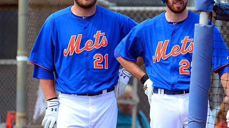 Mets' Lucas Duda and Ike Davis get ready for batting...
