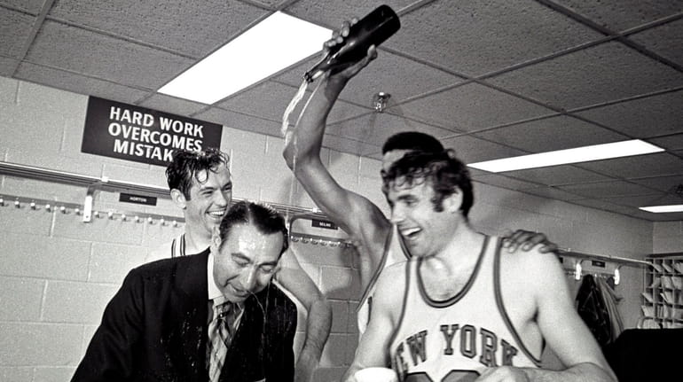 Dave DeBusschere and Bill Bradley celebrate the Knicks' NBA championship triumph...