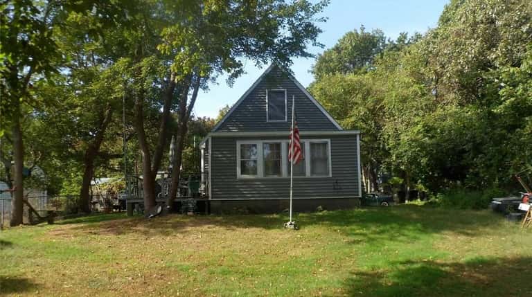 This Hampton Bays Cape is on the market for $385,000.