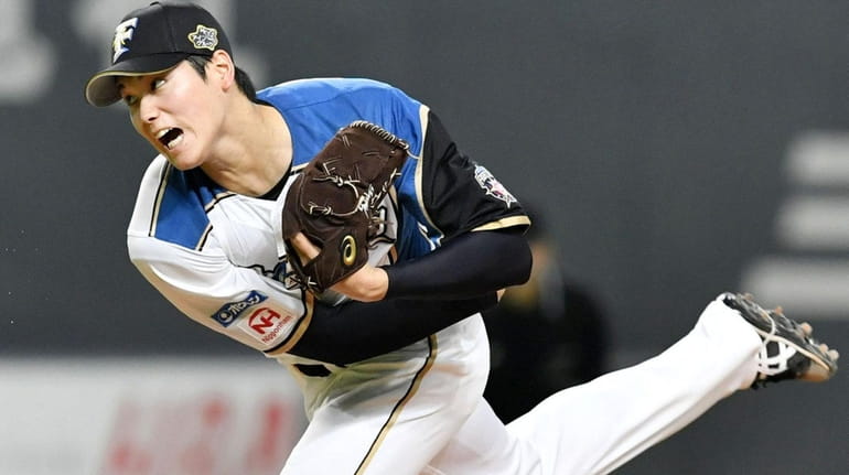 Shohei Ohtani of the Nippon Ham Fighters delivers at Sapporo...