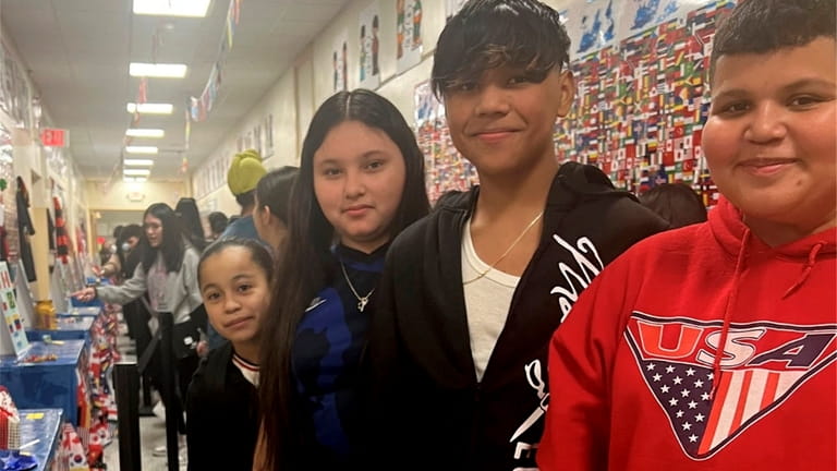 Hicksville Middle School’s Multicultural Club hosted a World’s Fair in which...