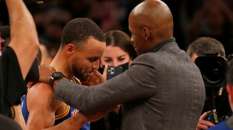Stephen Curry #30 of Golden State meets with Ray Allen...