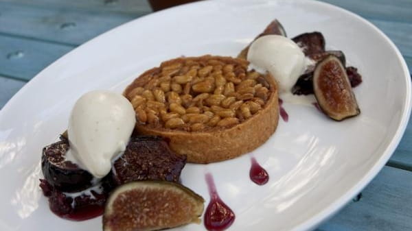 The honey-pine nut tart, served with fresh figs, at the...