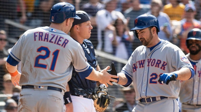 Mets' Adrian Gonzalez, right, celebrates his three-run homer with Todd...
