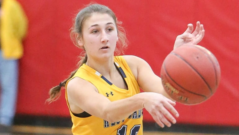 West Babylon's Lacey Downey throws a pass in the second quarter...