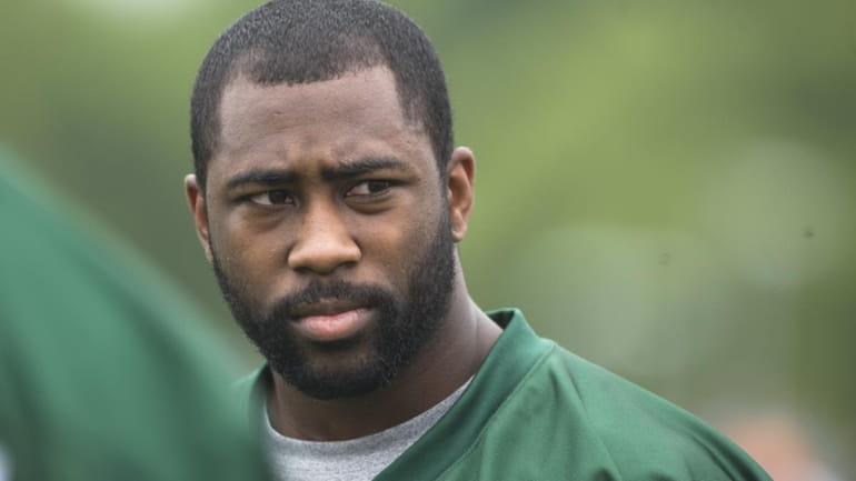Cornerback Darrelle Revis looks on during Jets minicamp at their...