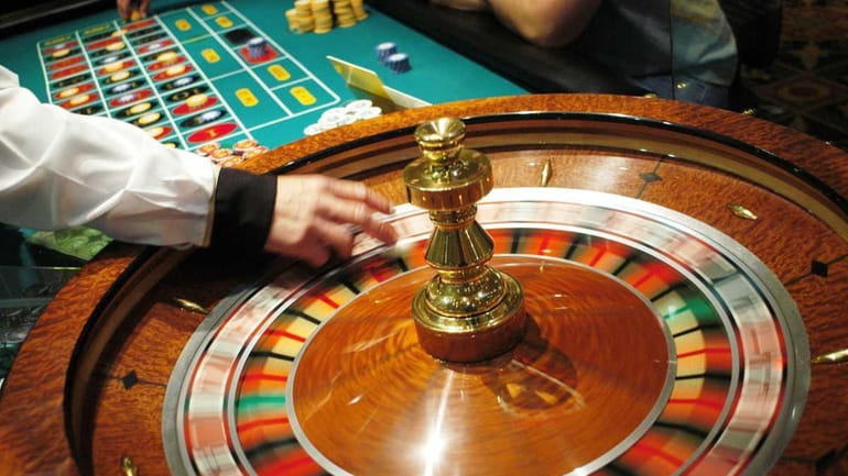 The roulette wheel spins at Caesars Atlantic City July 8,...