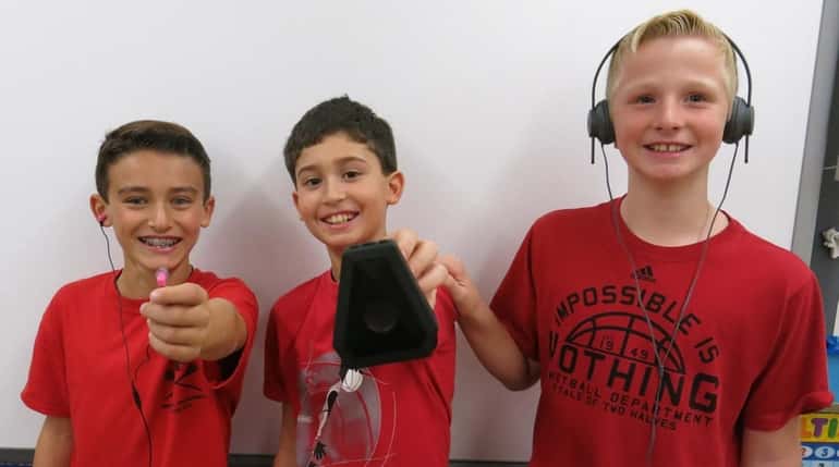 Kidsday reporters Brayden Fitzpatrick, left, William Carmenaty and Kevin Taylor,...