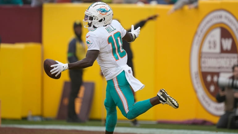 Miami Dolphins wide receiver Tyreek Hill (10) celebrates after scoring...