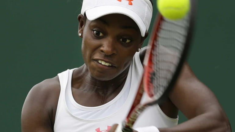 Sloane Stephens of the United States returns a shot against...