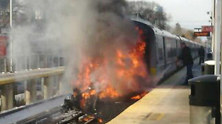 A fire erupts after an LIRR train struck a car...