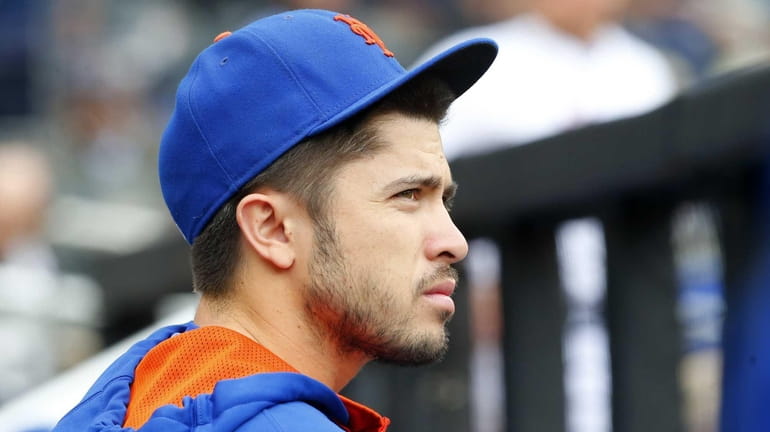 Travis d'Arnaud of the Mets looks on during a game...