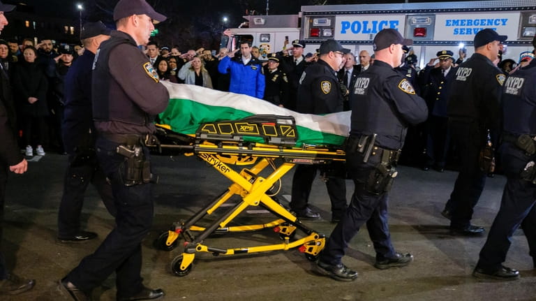 The body of slain NYPD Officer Adeed Fayaz is transferred...