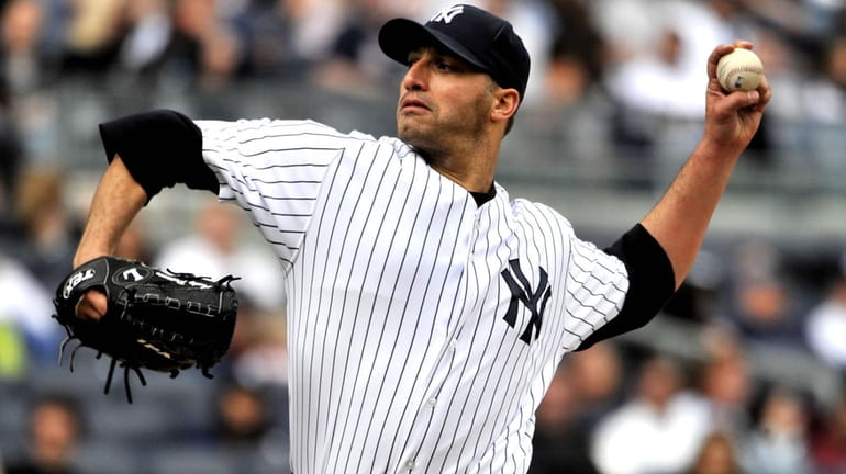 Andy Pettitte pitches in the seventh inning against the Texas...