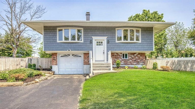 This South Setauket high-ranch is listed for $389,990.
