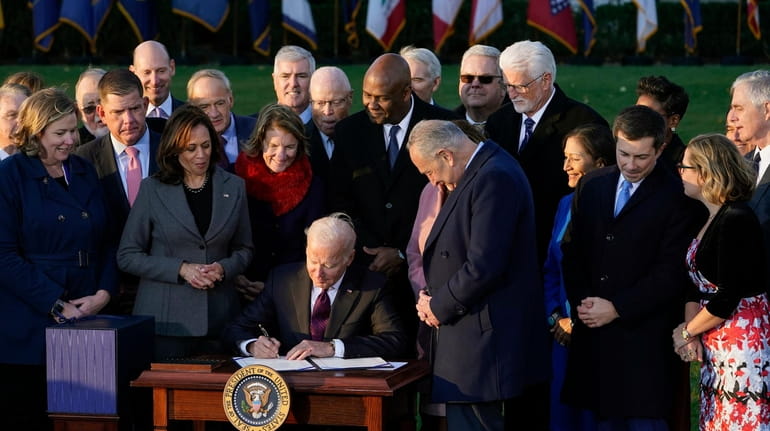 President Joe Biden signs the $1.2 trillion bipartisan infrastructure bill...