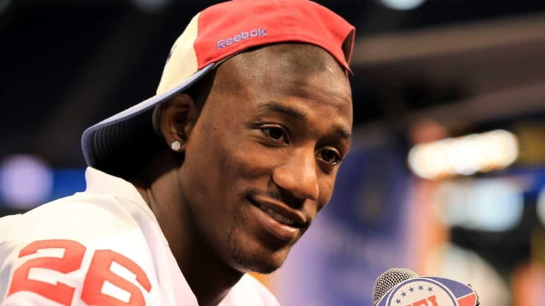 Antrel Rolle answers question from the media during Media Day...