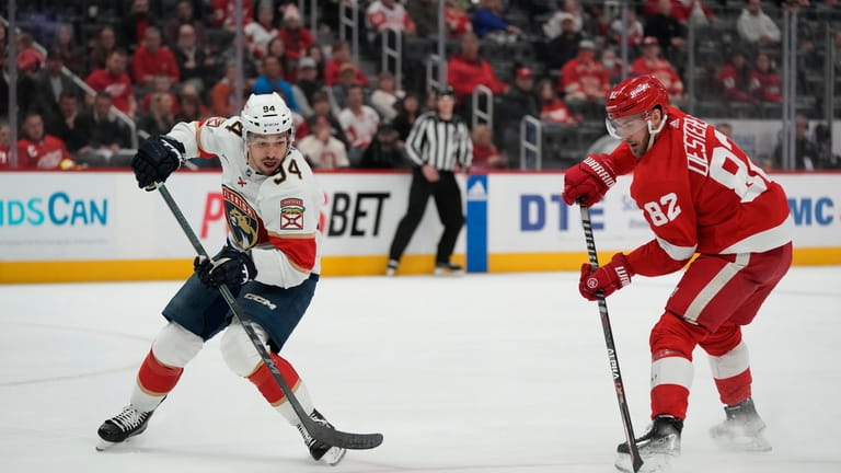 Florida Panthers left wing Ryan Lomberg (94) and Detroit Red...