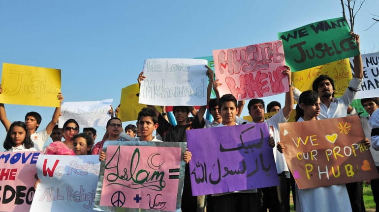 Pakistani students protest against the controversial film "Innocence of Muslims"...