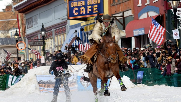 A skijoring team competes in Leadville, Colo., on Saturday, March...
