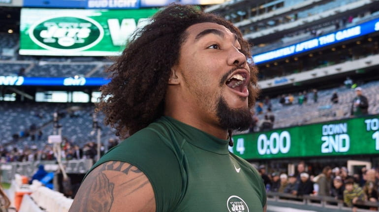The New York Jets' Leonard Williams leaves the field after...