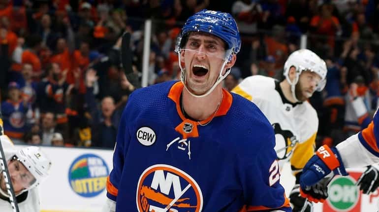 Islanders center Brock Nelson celebrates after he scores a power-play...