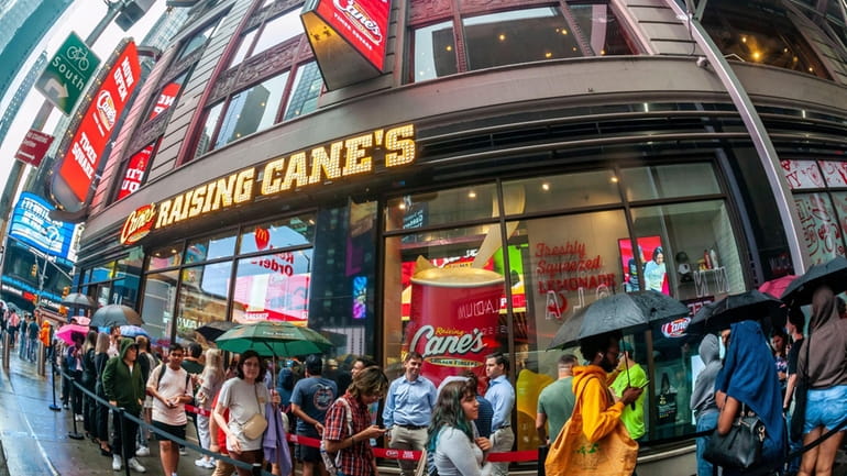 Chicken-finger lovers at the grand opening of Raising Cane's Global Flagship...
