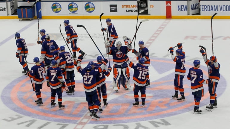 The Islanders celebrate after defeating the Buffalo Sabres at NYCB...