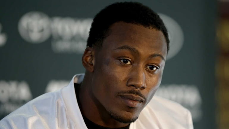 Wide receiver Brandon Marshall gives a press conference after an...