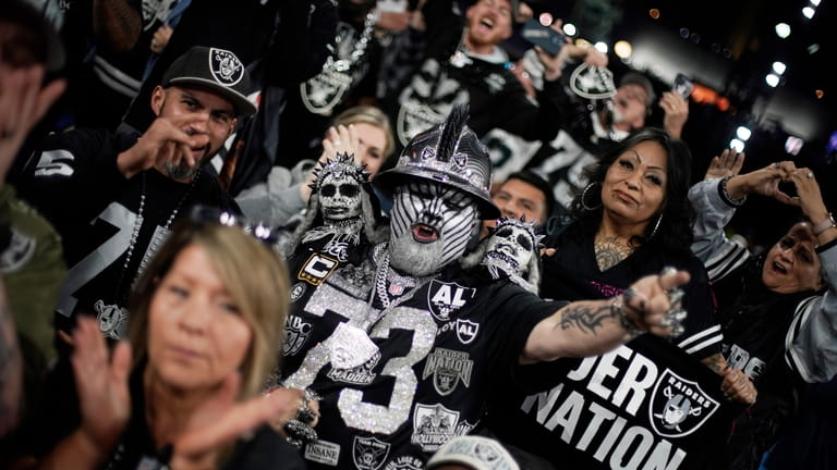 Las Vegas Raiders fans cheer during the third round of...