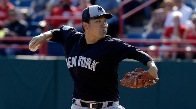 The Yankees' Masahiro Tanaka pitches against the Washington Nationals on...